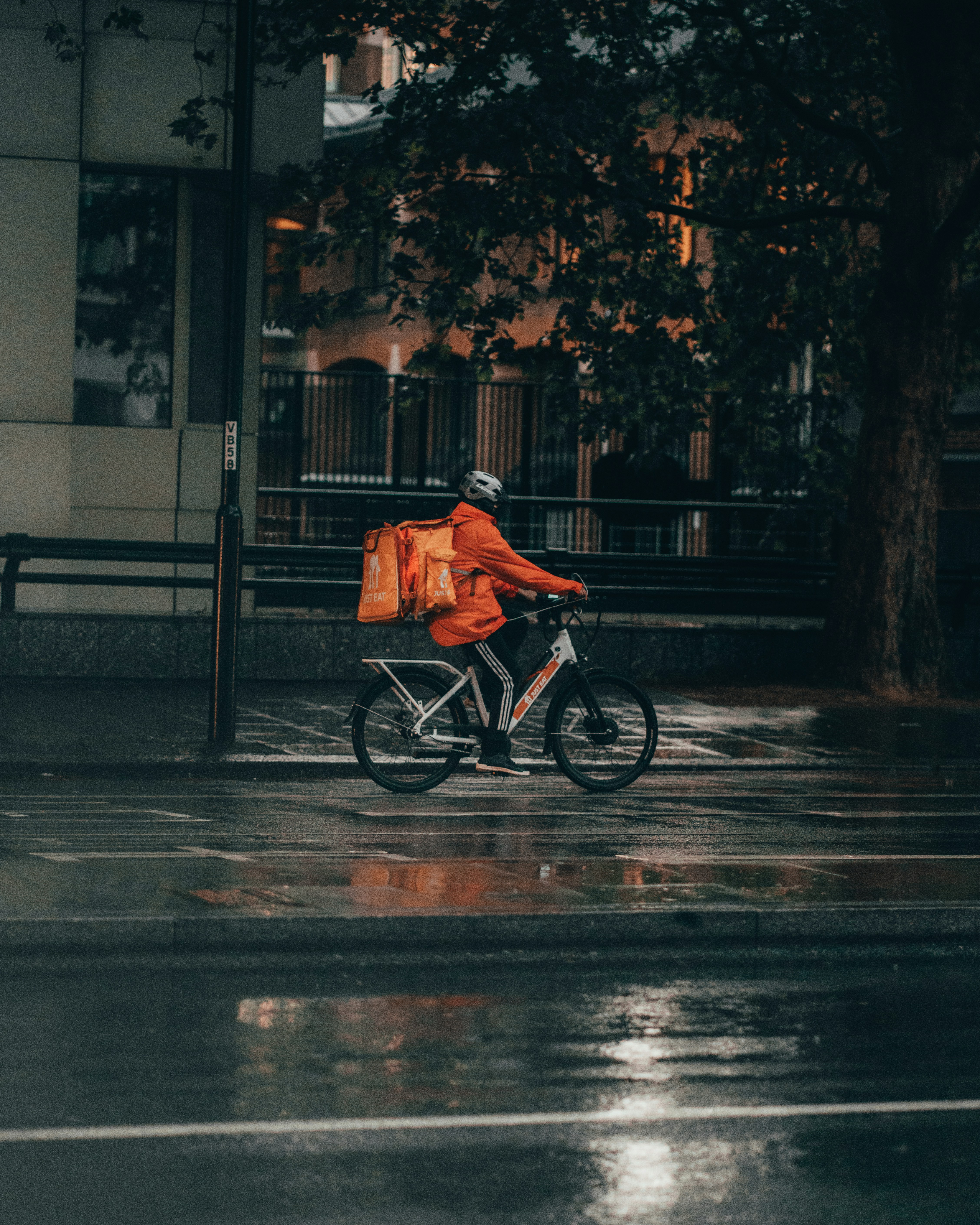 Delivery driver riding a bicycle through the city